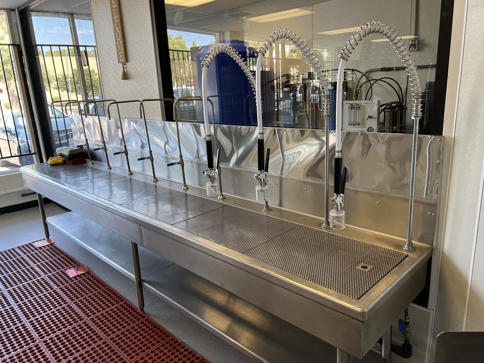 Custom stainless steel dispensing table in a water store